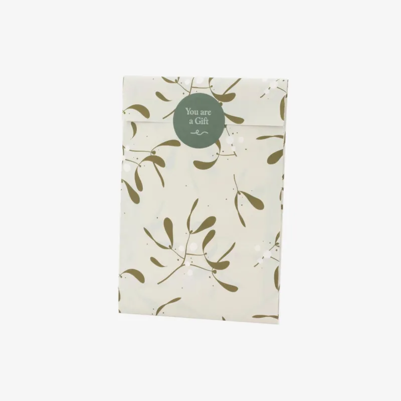 Packaged product with leaf pattern and 'You are a Gift' tag on a white background